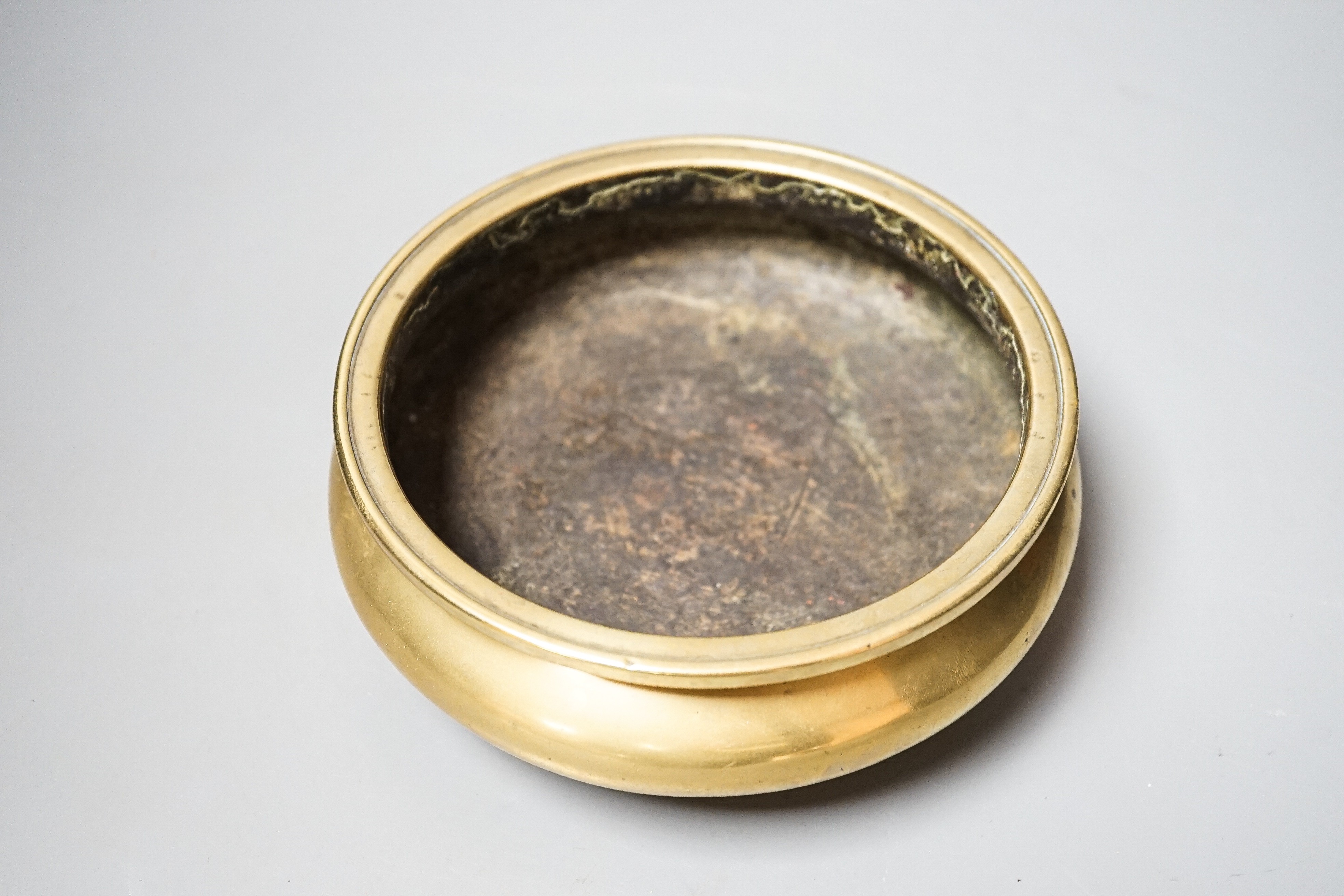 A Chinese bronze censer, ding, Xuande mark, 18th / 19th century, diameter 16.6cm, height 6.7cm